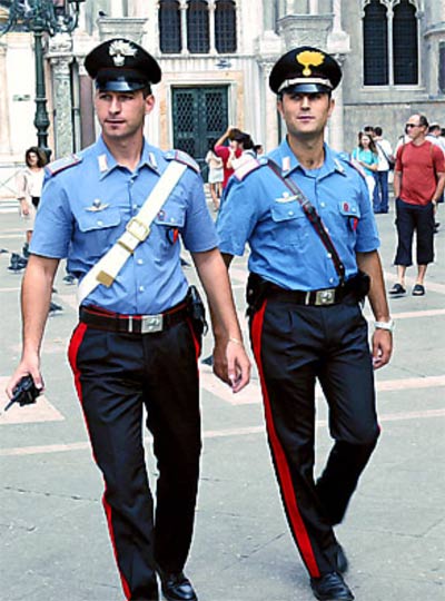 Italian policemen in flattering light blue uniforms
